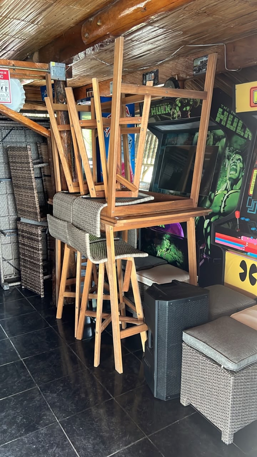 The game room — arcade cabinets in, furniture being set out