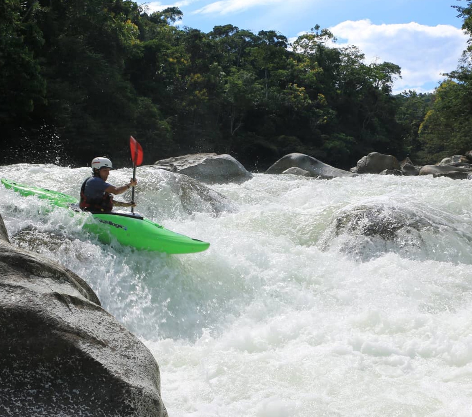 Kayaking the rapids below the lodge