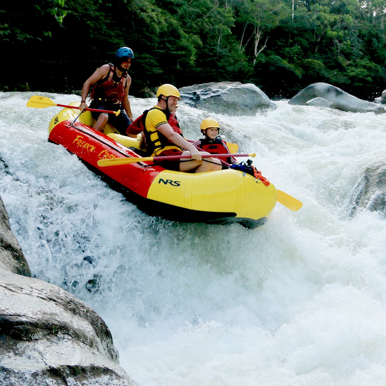 Freakn Creekn rafting crew dropping a chute